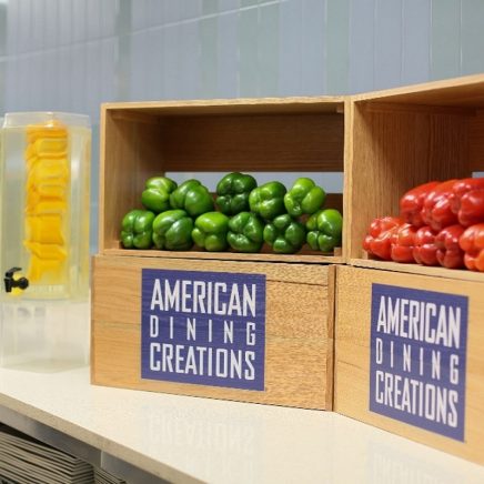 Americcan dining boxes full of green and red peppers