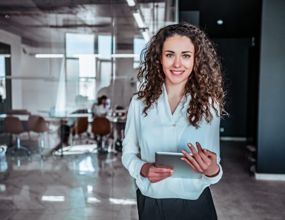 women with ipad in office