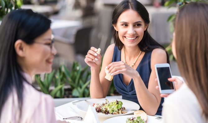 women professionals talking over mal