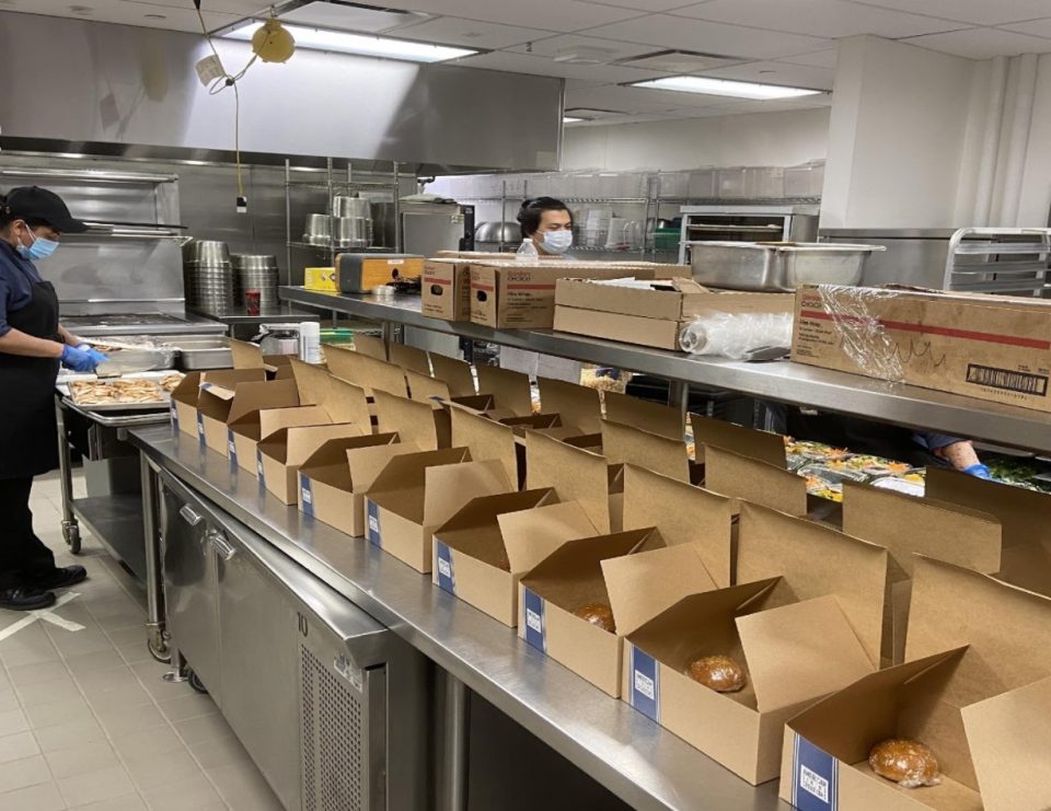 cardboard to go boxes lined up in kitchen