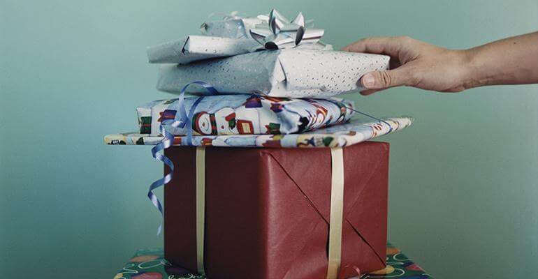 tower of presents with winter themes wrapping paper