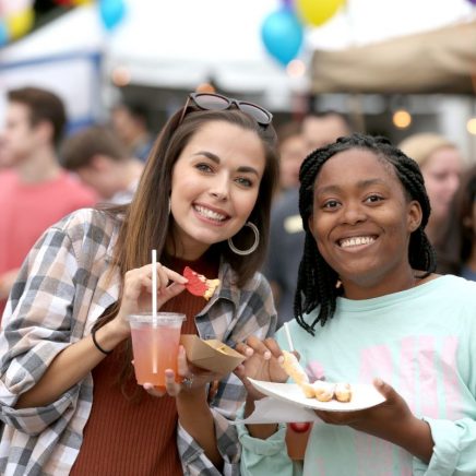 two friends have snacks at Union Boardwalk together