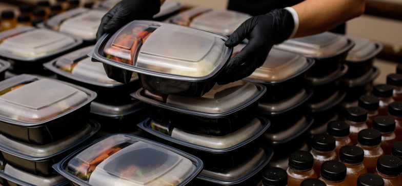 Lunch box with food in the hands. Catering