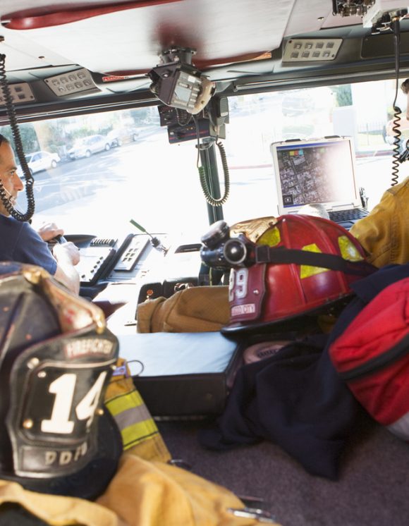 Firefighters in truck travelling to an emergency