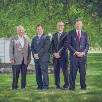 Four members of the American Food and Vending Family gather for a portrait